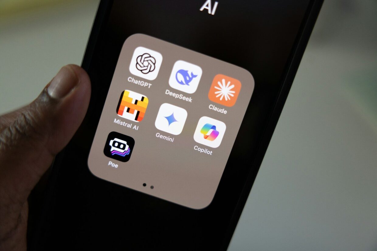 A person holding a smart phone in their hand